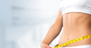 woman using measuring tape - secret to burn belly fat