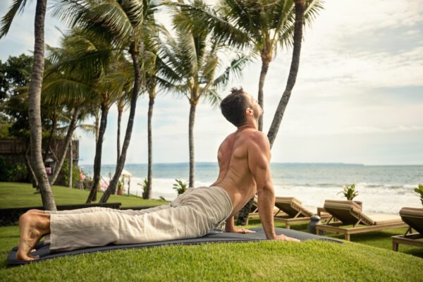 man yoga outdoors stretching 