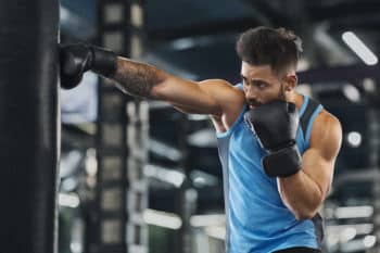 Young Sportsman Boxing Workout At Gym Guy Punching Boxing Bag