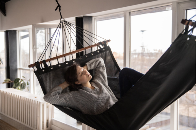 woman afternoon snooze hammock