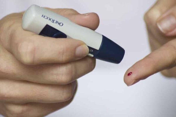 finger poke blood needle diabetes insulin