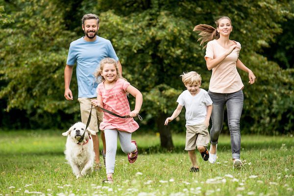 Happy,Children,And,Parents,With,Dog,As,Family,Running Playing natural activity. Family Healthy Fit During Pandemic