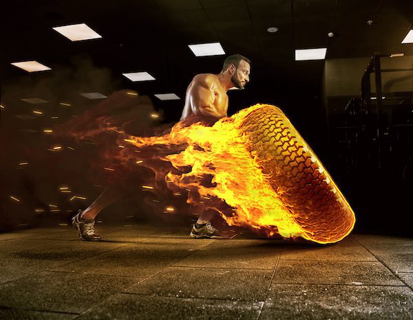 Adult,Male,Bodybuilder,Posing,In,The,Gym,And,Perform,Various cross fit tire fire