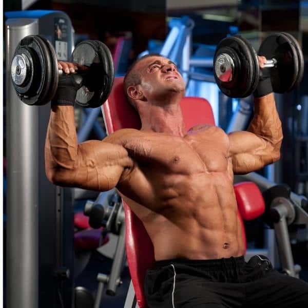 muscular-man-performing-dumbbell-shoulder-press