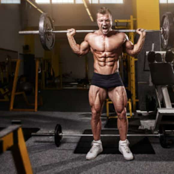Muscular Man Squat Weightlifting Shutterstock 522643456
