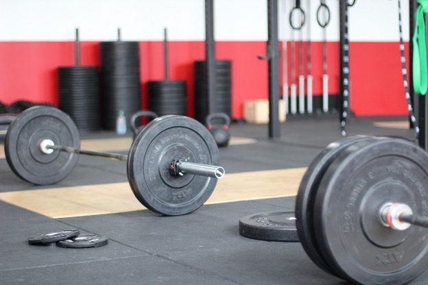 Ways to Reduce Injuries and Damage When Lifting Weights. Barbell, Gym, Mat