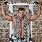 How to Do a Weighted Overhand Grip Pull-Up