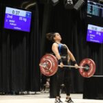 What Are The Top Olympic Weightlifting Records. woman-lifting-weights-on-platform