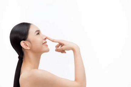 woman touching nose