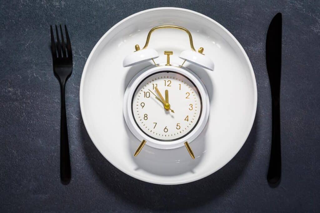 plate with a clock fork and knife
