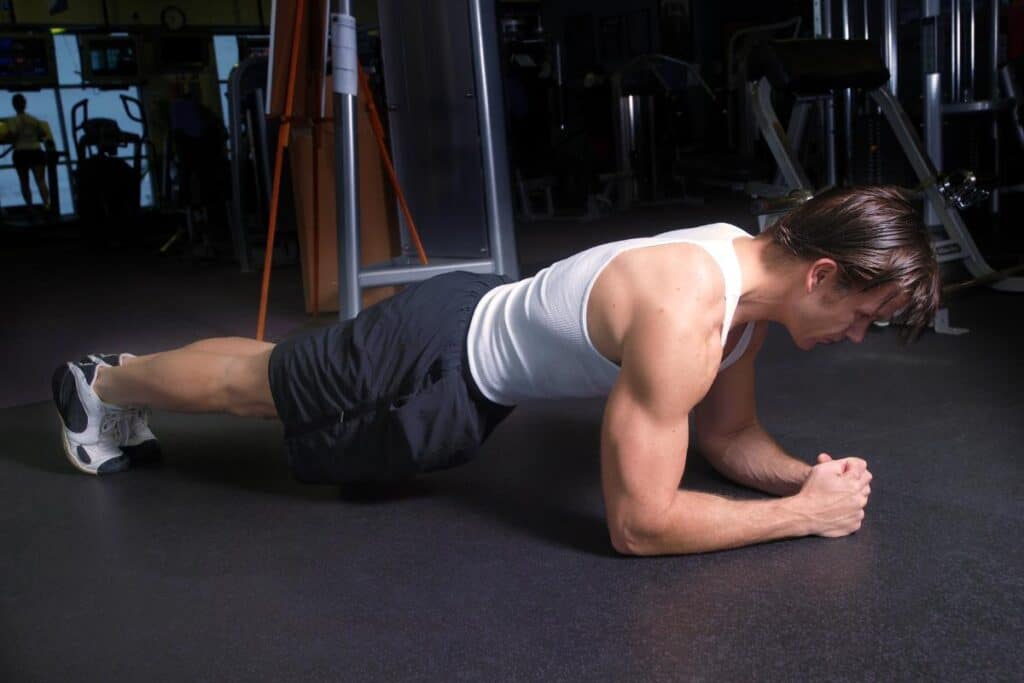 Man performing a plank a ab exercise workout