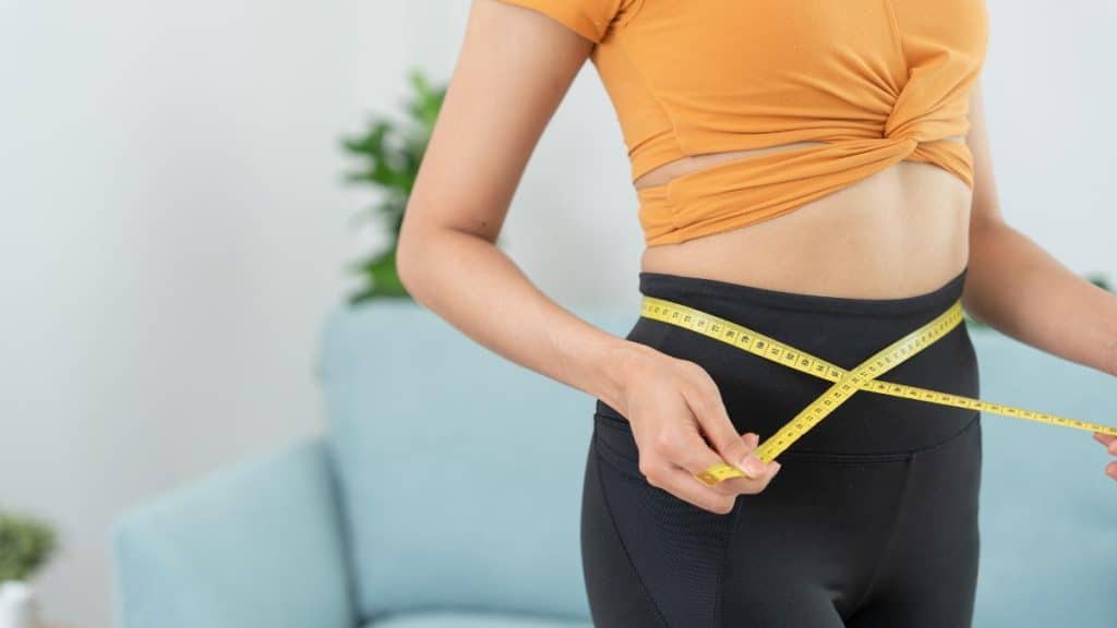 woman, weight loss, calories, measuring tape, after exercise