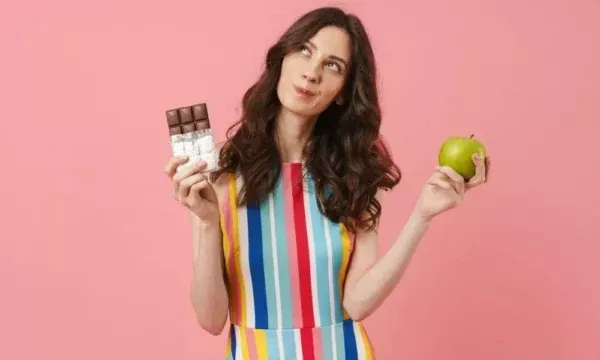 woman junk food unhealthy diet apple fruit decision healthy