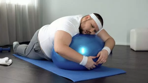 man obsese sleep exercise ball